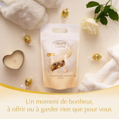 Bile de ciocolată albă LINDOR, 1 kg și LINDOR | pungă resigilabilă de 1 kg | aprox. 80 de bile de ciocolată cu lapte și mentă cu umplutură | Pachet vrac, cadou pralină, cadou ciocolată