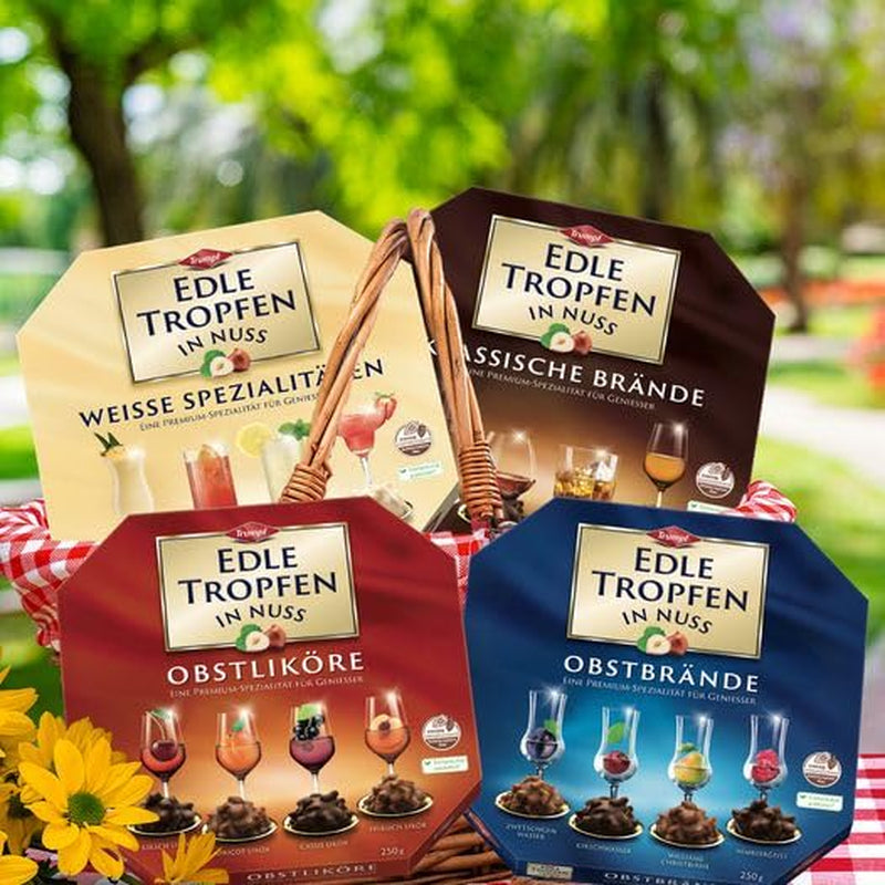 Picături fine în nuci clasice Brandies 250g, praline de ciocolată umplute cu lichid, cu glazură de ciocolată cu lapte și bucăți crocante de alune de pădure