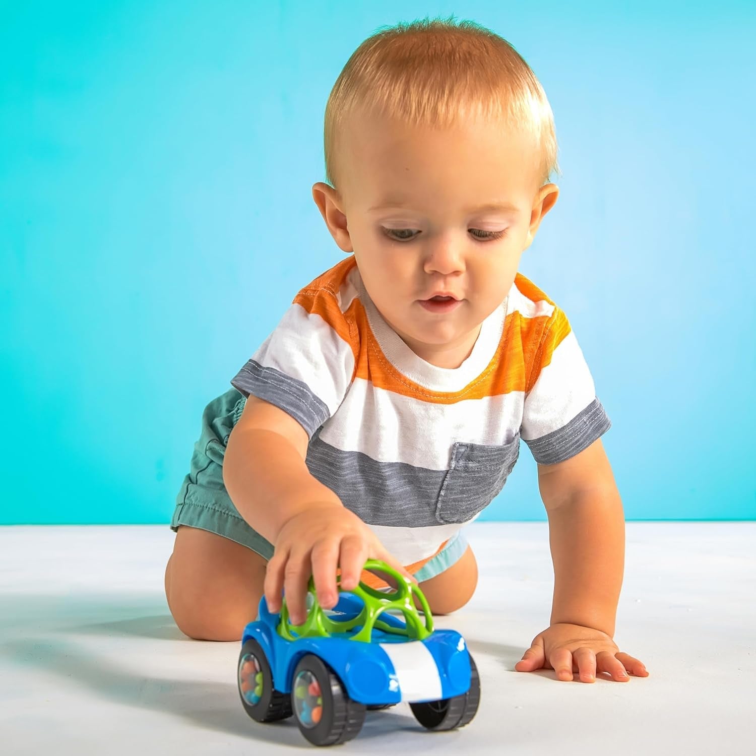 Bright Starts, Oball, mașină de jucărie cu zornăitor, verde-albastru Jucarii Bebe Naty Shop